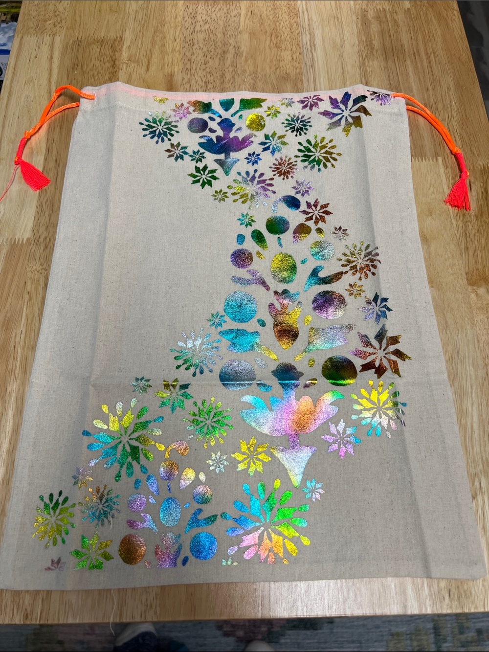 Free People Holographic Floral Canvas Drawstring Bag with Neon Orange Tassels